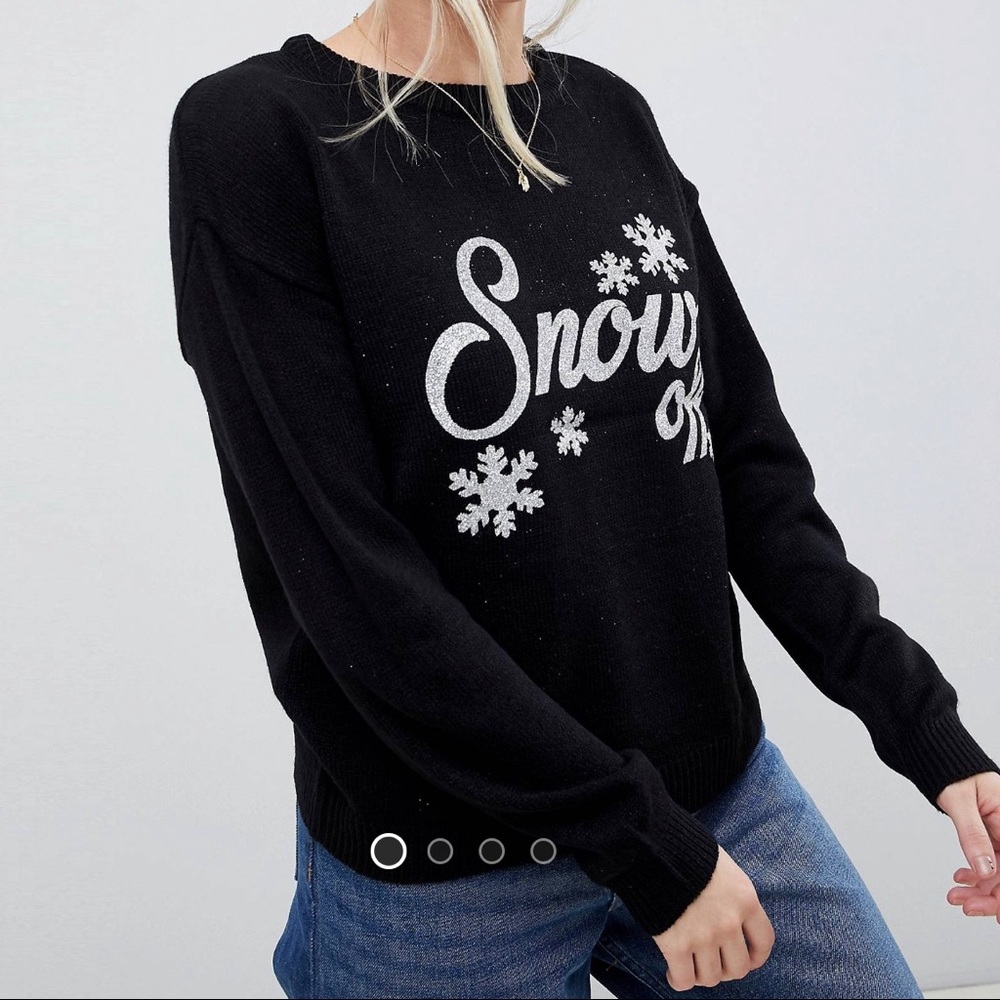 Black knit sweater with glitter embellishment